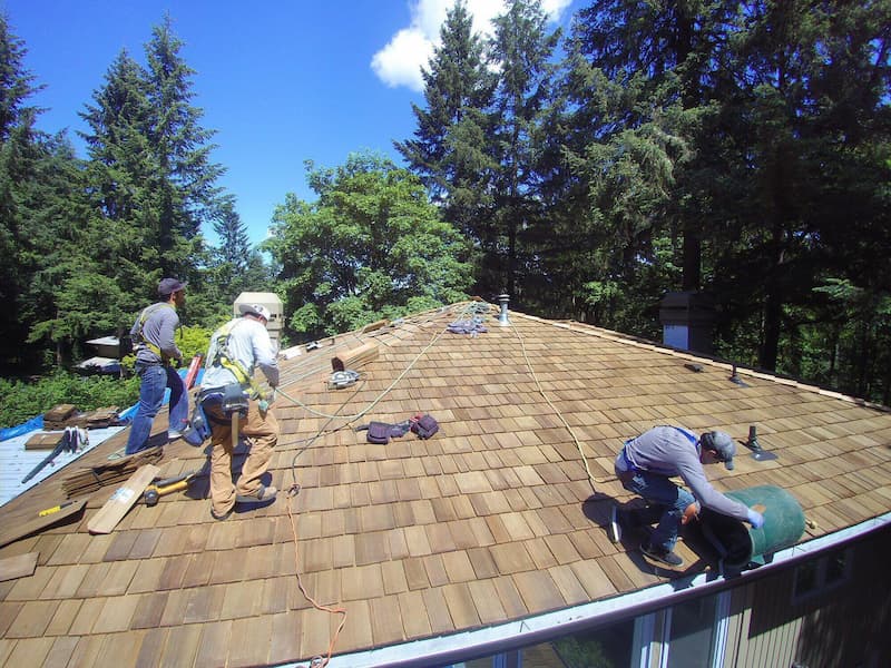 Roofers in Portland repairing a roof